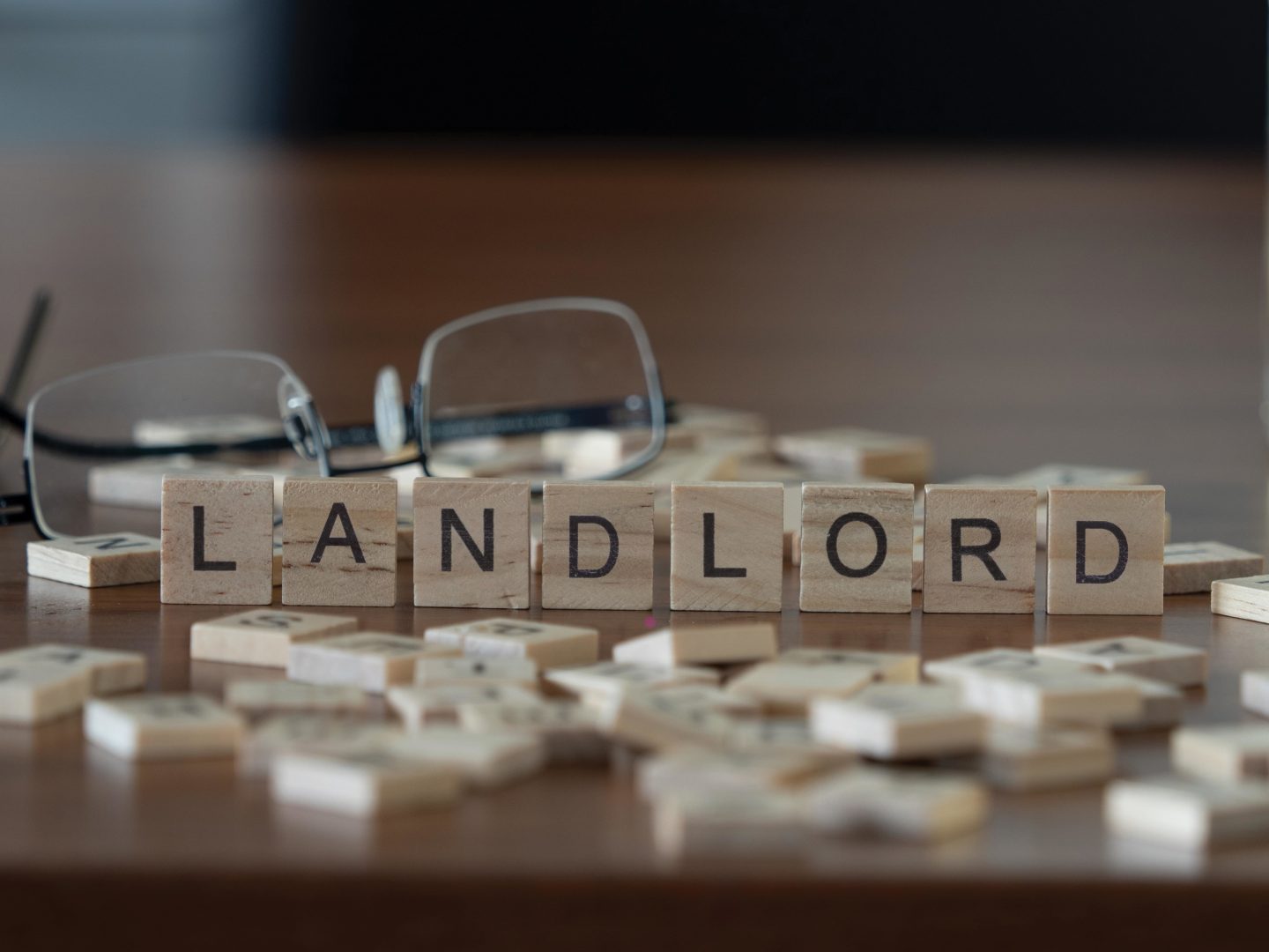 landlord the word or concept represented by wooden letter tiles