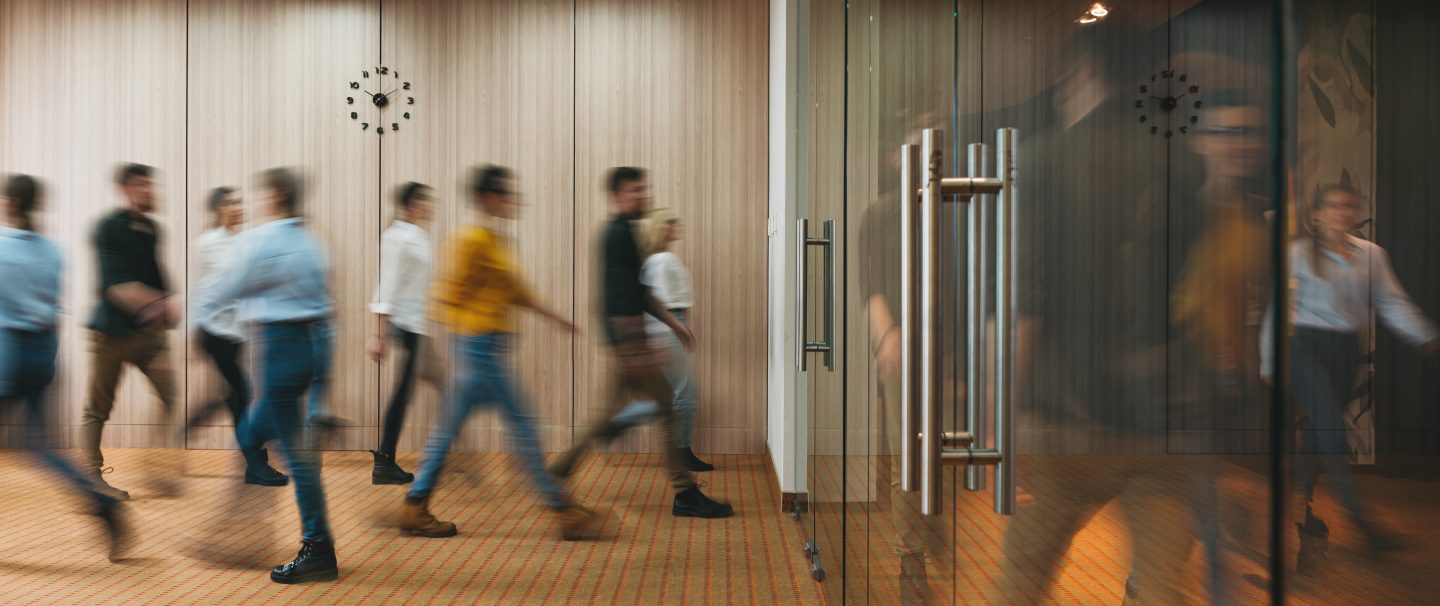 Group of office people walking at office open space. Team of business employees at coworking center. People at motion blur. Concept working at action